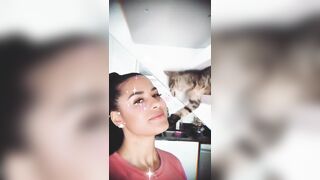 Katya Elise Henry: Kat giving a kiss a cat