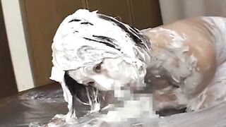Horny Japanese couple have sex in thick whipped cream