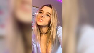 Tongue play and nice cleavage