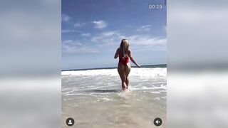 red swimsuit at the beach