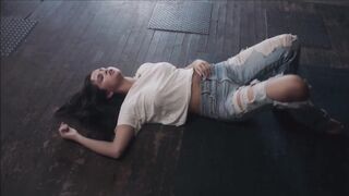 Celebrities: Selena Gomez in a constricted white shirt rolling on the floor!
