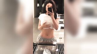 Kylie Jenner in white top, piercing visible, flat stomach, phat ass and extremely attractive!!! This is a MILF!!!! - Celebs